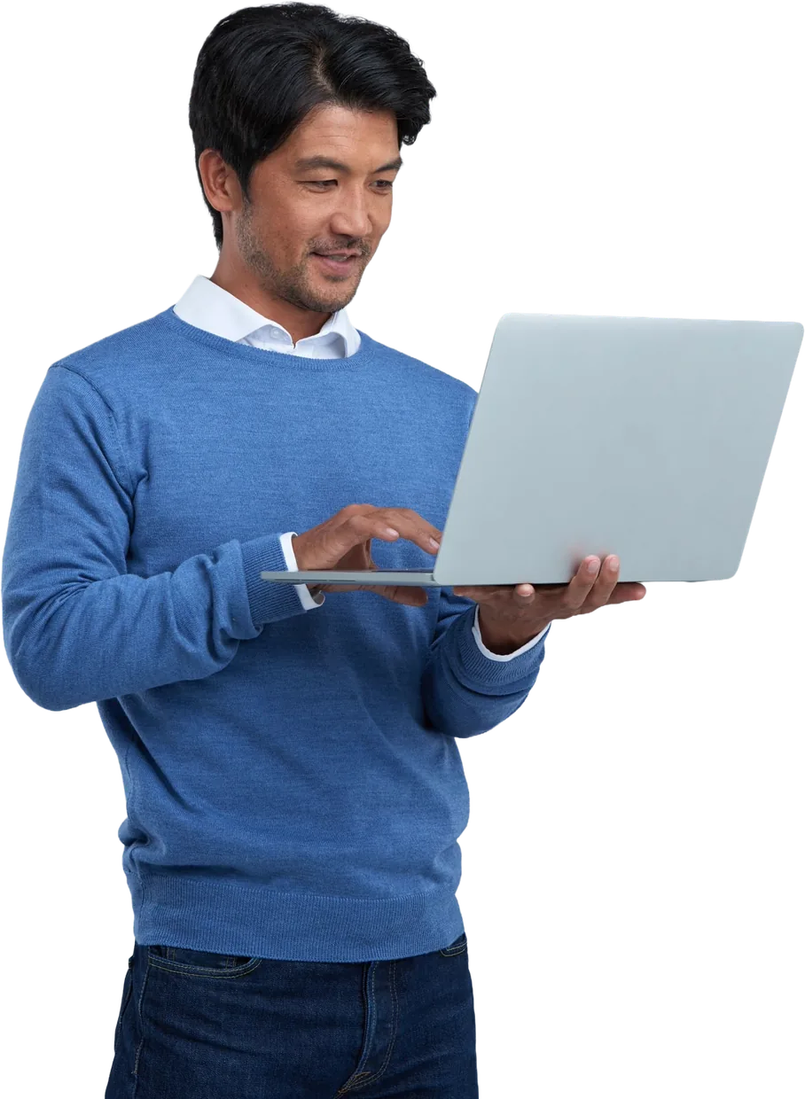 A business owner managing their trade on a laptop